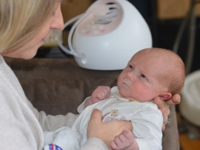 mom talking to her one month old baby