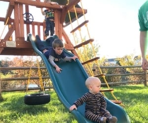 baby and toddler doing outdoor playground daily activities