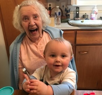 Great grandmother with great grandson on her lap