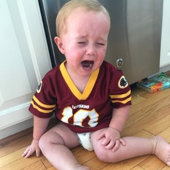 toddler throwing a tantrum in a jersey